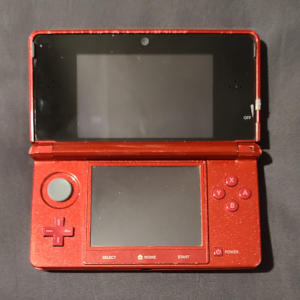 Metallic red clamshell-hinged rectangles, with a screen set in each. Buttons surround the bottom screen.