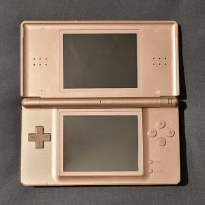 Rose-gold clamshell-hinged rectangles, with a screen set in each. Buttons surround the bottom screen.