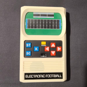 A small off-white slab with a screen and buttons.