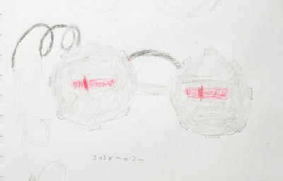 A rough, colored sketch of the goggles design. Unlike the final design, there is no exposed circuit board, just a coiled cable coming out of the left (wearer's right) side.